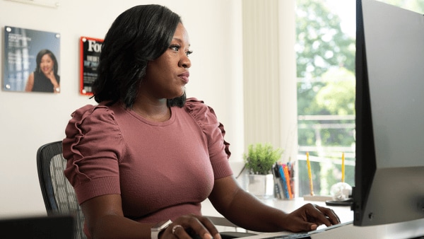 Woman sitting at computer working