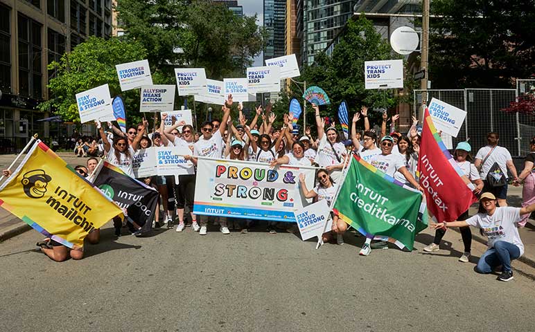 A large group of people holding signs and banners.