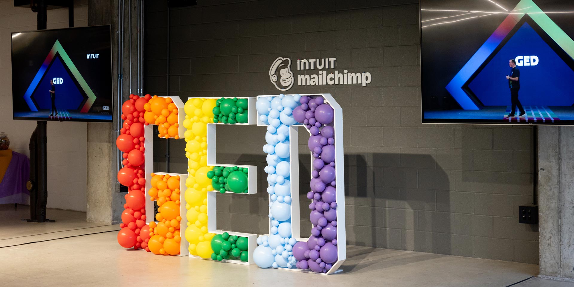 A large display of colorful balloons and balls.